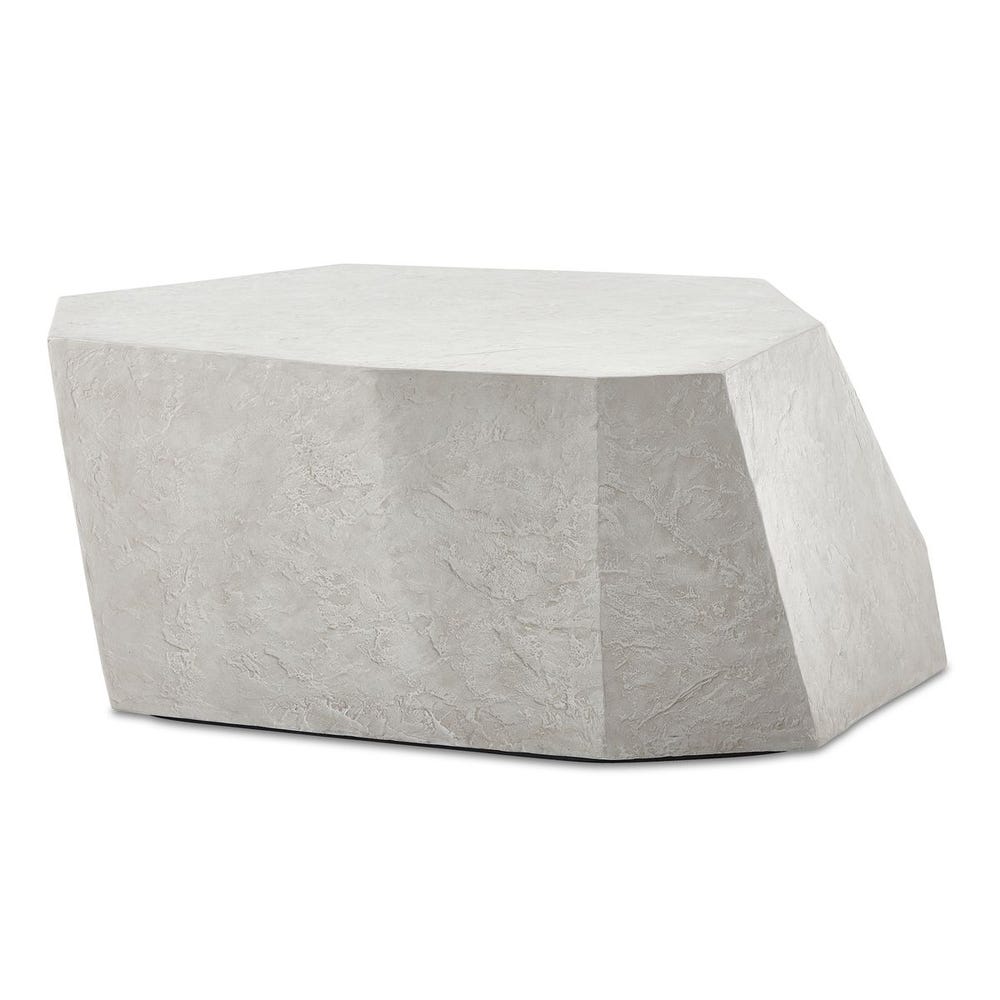 Geometric stone-like ottoman on a white background