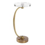 Gold table lamp with clear glass shade on a white background