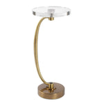 Decorative table with gold base and clear glass top on a white background