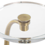 Glass table with gold metal base and clear glass top on a white background