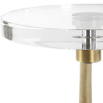 Glass table with a gold metal base on a white background