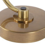 Close-up of a gold metal object with a handle on a white background