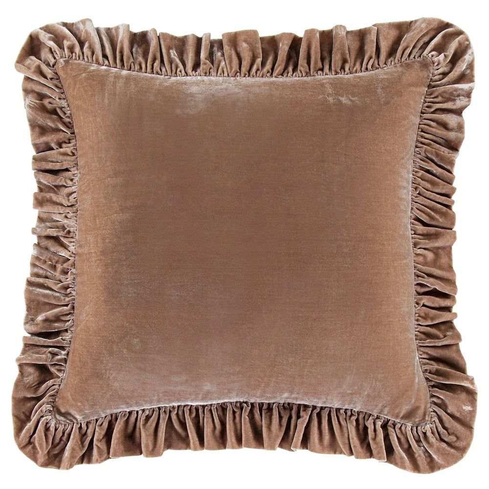 Brown velvet pillow with ruffled edges on a white background