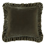 Brown velvet pillow with ruffled edges on a white background