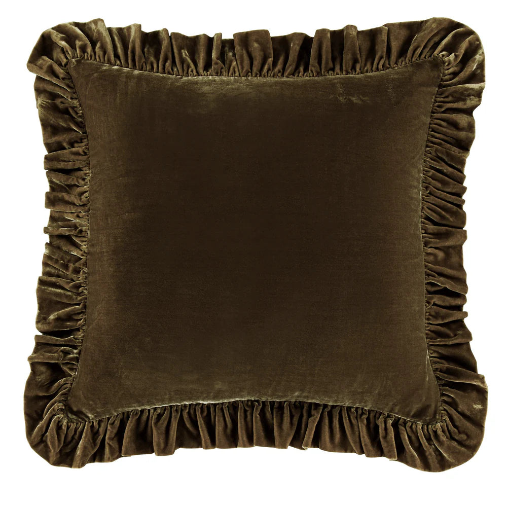 Brown velvet pillow with ruffled edges on a white background