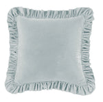 Light blue cushion with ruffled edges on a white background