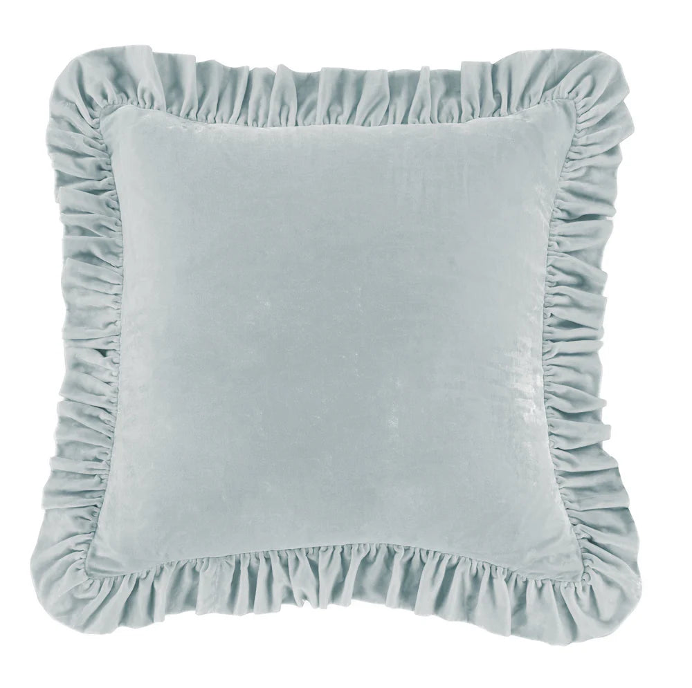 Light blue cushion with ruffled edges on a white background