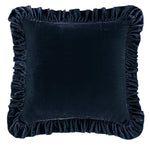 Navy blue velvet pillow with ruffled edges on a white background