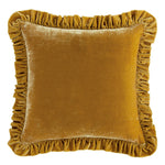 Mustard yellow velvet pillow with ruffled edges on a white background