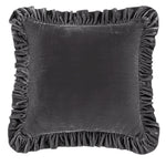 Gray velvet pillow with ruffled edges on a white background