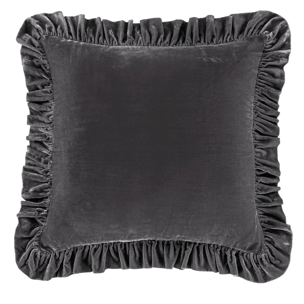 Gray velvet pillow with ruffled edges on a white background