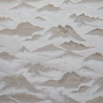 Textured pattern with beige and gray shapes on a light gray background