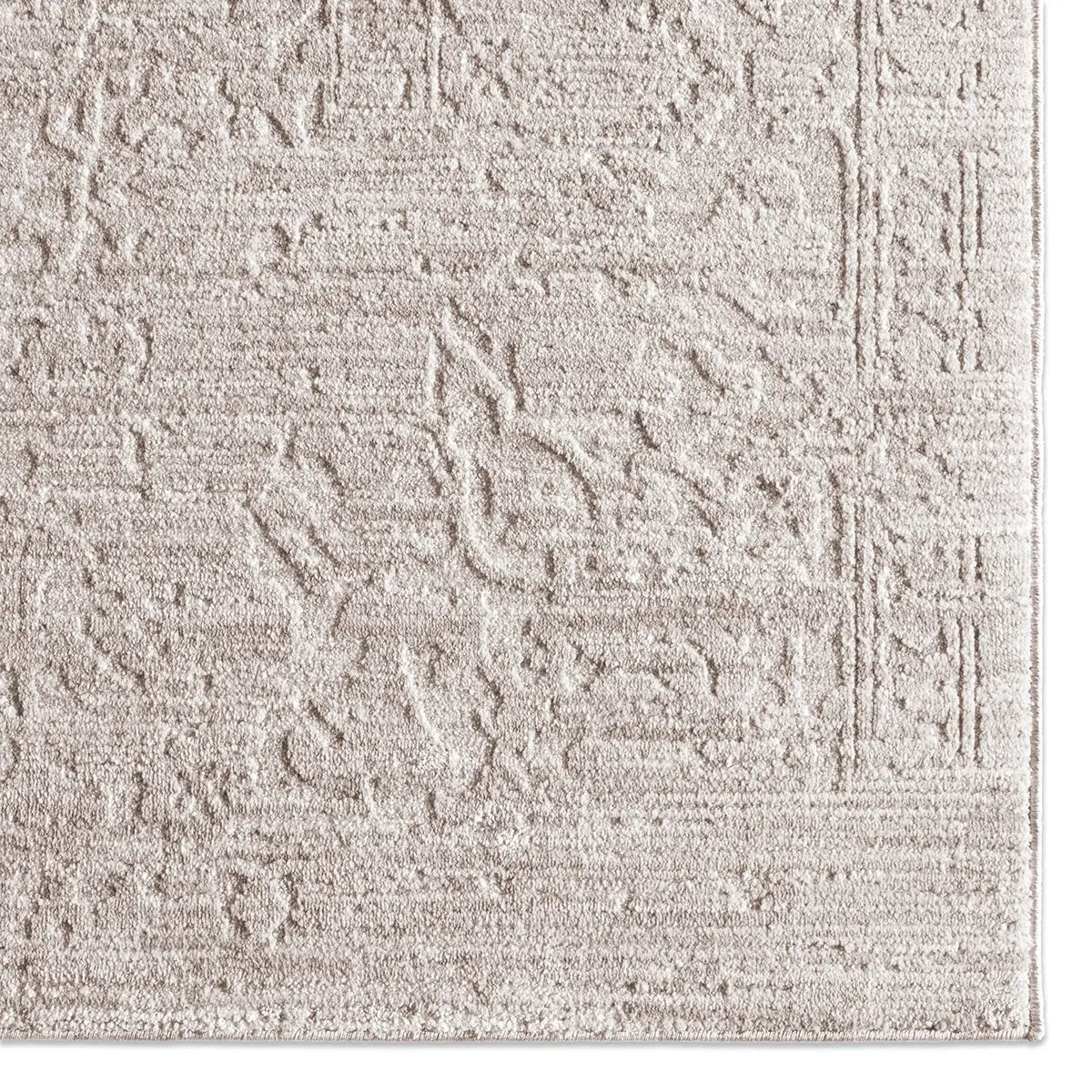 Textured beige rug with geometric pattern
