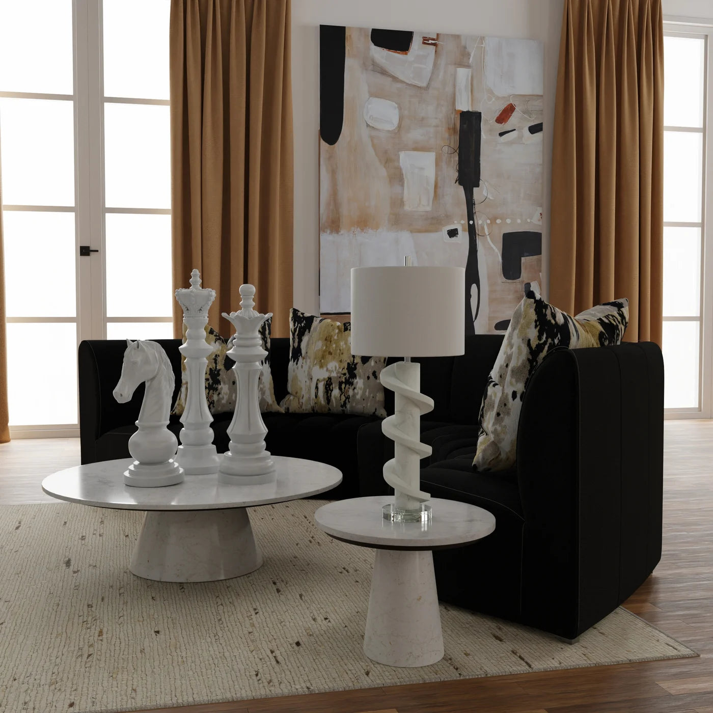 Modern living room with black sofa, white coffee table, and decorative items.