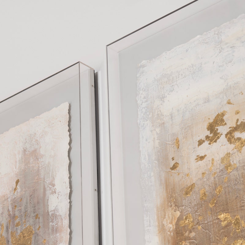 Acrylic wall art featuring an abstract design with gold, gray, and white colors.