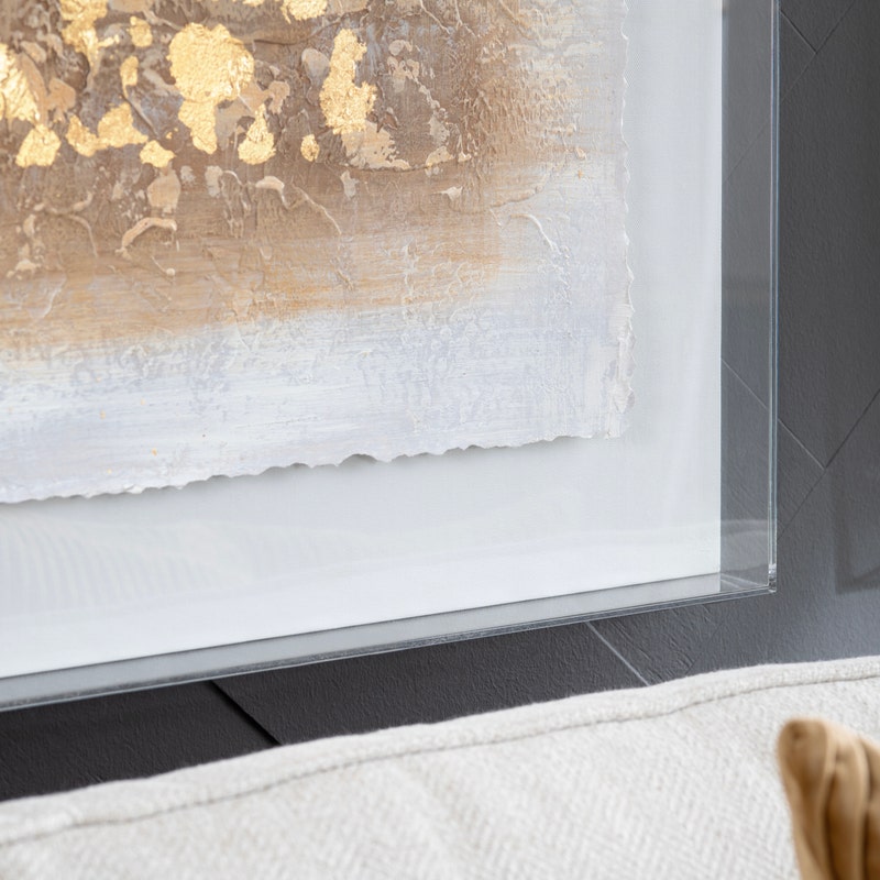 Acrylic wall art featuring a abstract design with gold and white colors.