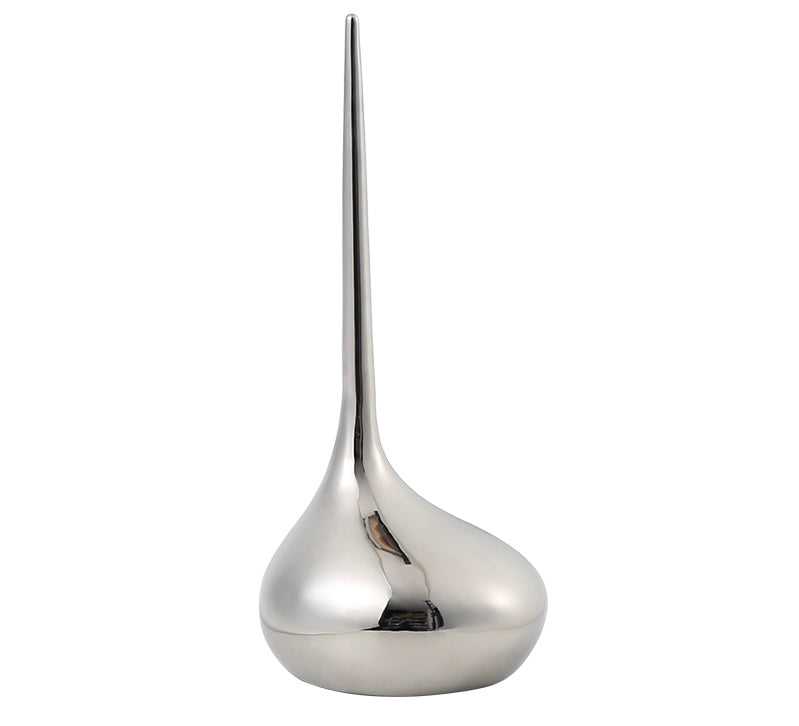 A silver decorative sculpture with a smooth, tapered form.