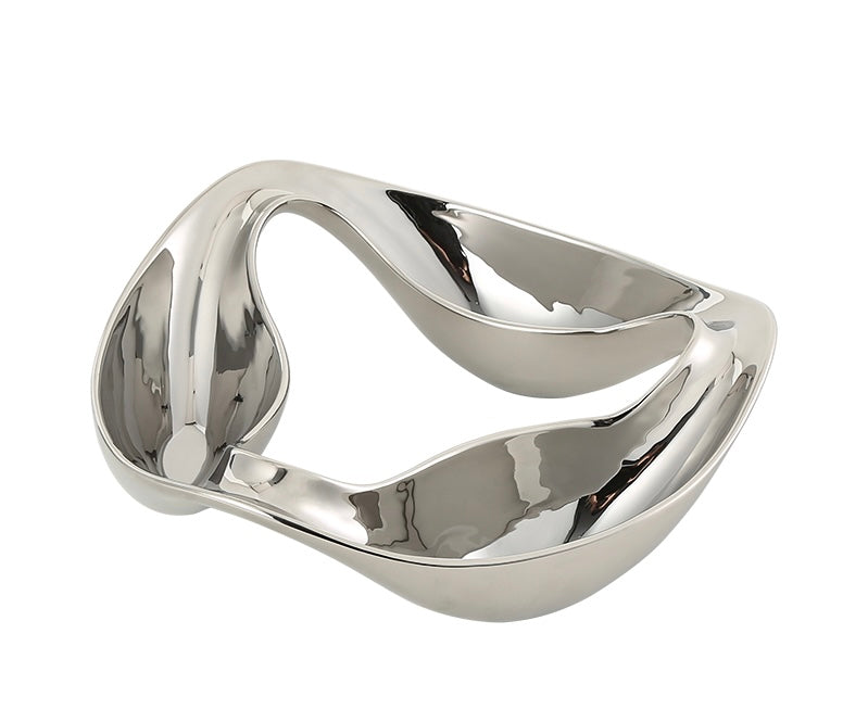 A silver porcelain tray with a smooth, curved surface and no visible handles.