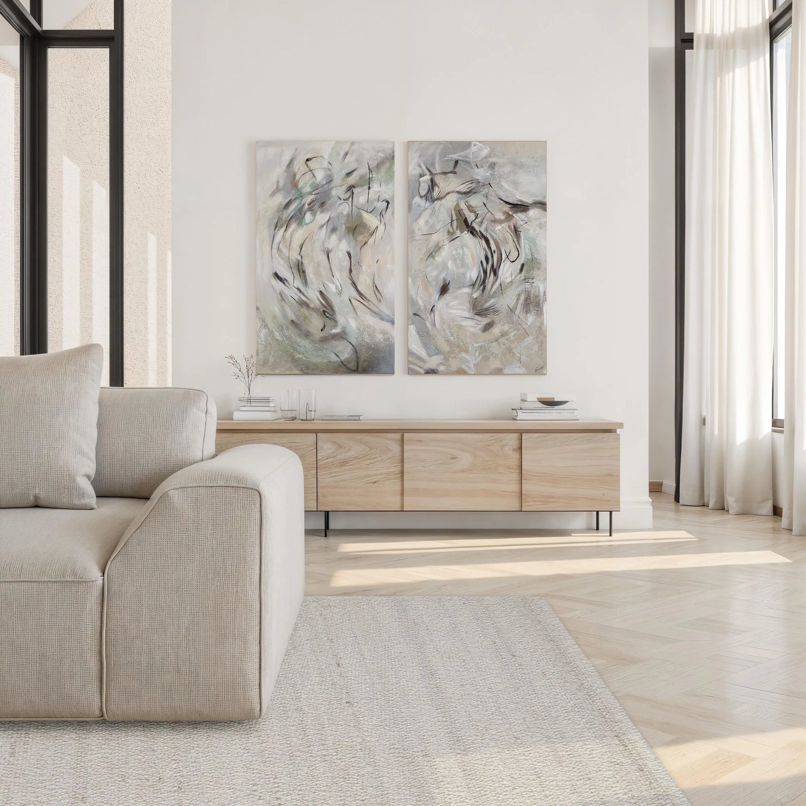 Modern living room with a beige sofa, wooden sideboard, and abstract wall art.