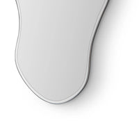 Close-up of a white electronic device on a light gray background