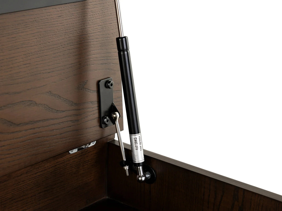 Wooden cabinet with a black hydraulic lift mechanism on a white background