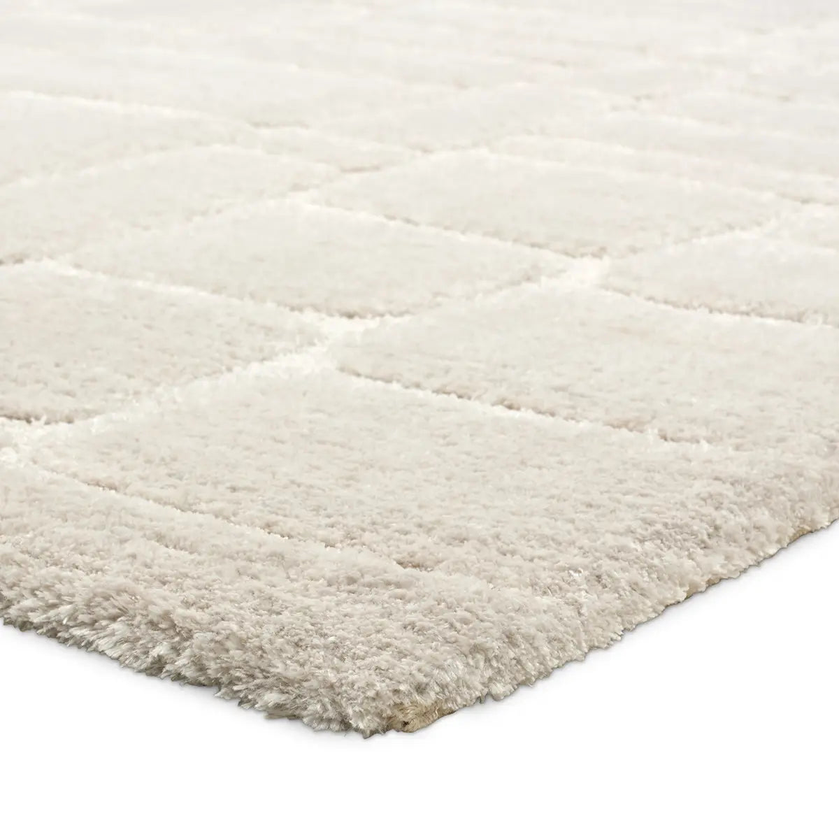 Beige shaggy rug on a white background