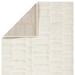 Textured beige rug with a subtle pattern on a white background