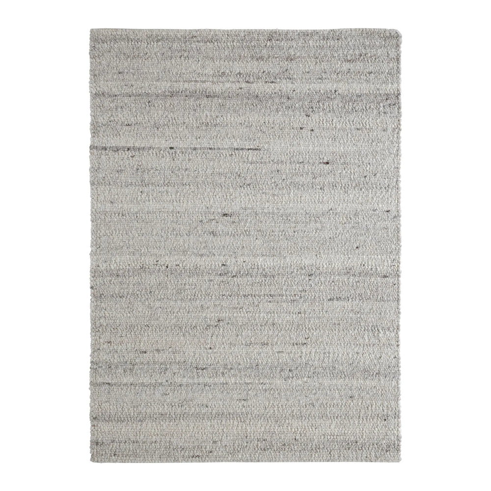 Gray textured rug on a white background