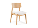 Wooden chair with a white cushion on a white background