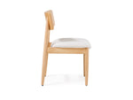 Wooden chair with a white cushion on a white background