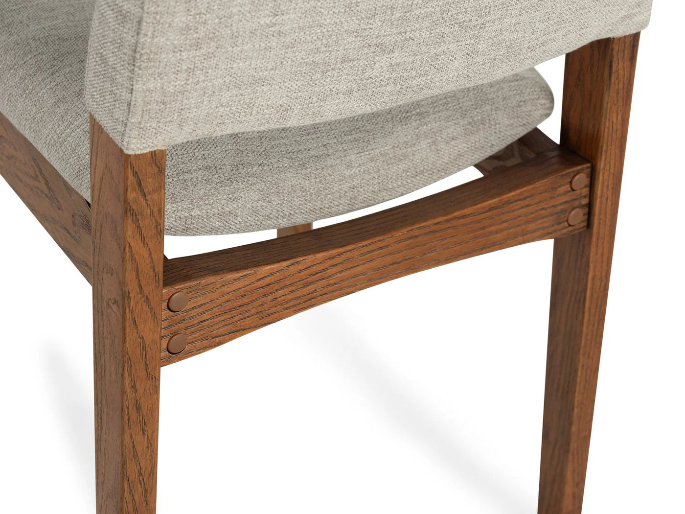 Wooden chair with gray cushioned seat on a white background