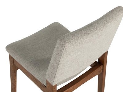 Chair with gray cushioned backrest and seat on a white background