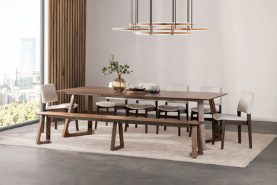 Dining room with a wooden table and chairs in a modern interior setting.