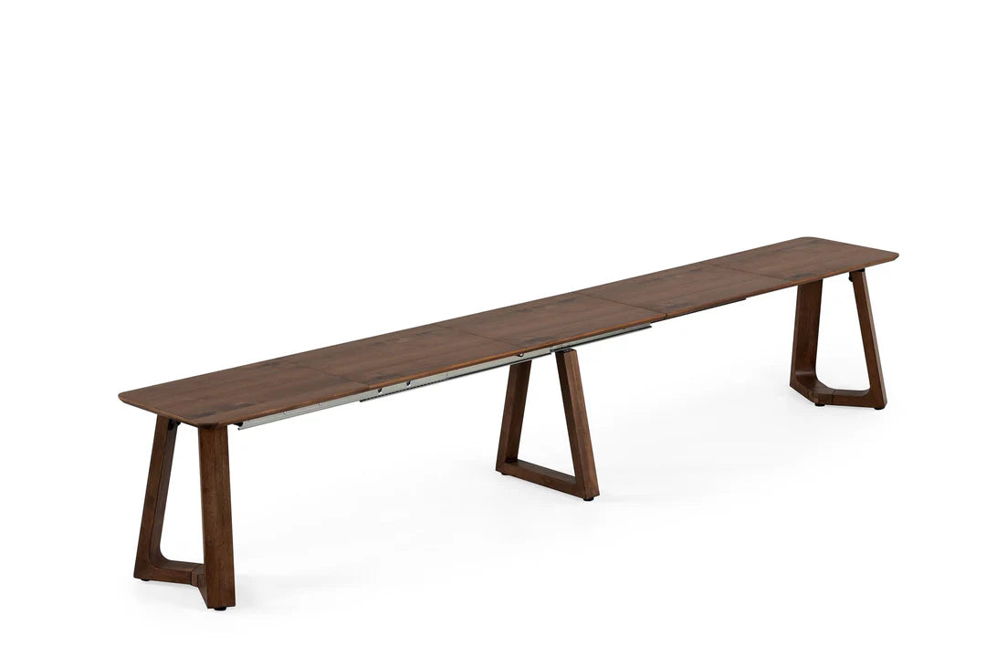 Long wooden dining table with a minimalist design on a white background
