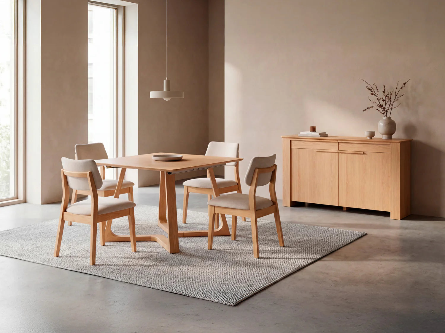 Dining room with wooden table and chairs in a modern interior setting.