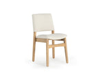Chair with white cushioned seat and backrest on a white background