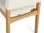 Wooden chair with white cushion on a white background