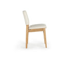 Chair with white cushioned seat and backrest on a white background