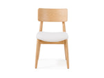 Wooden chair with a white cushion on a white background