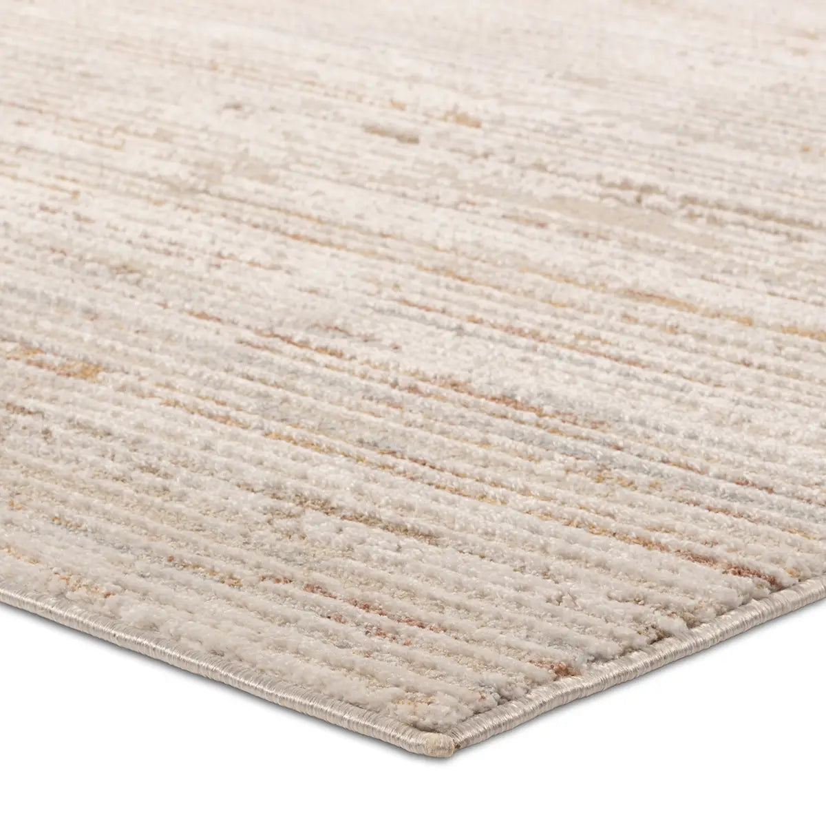A power loomed area rug with beige and brown tones.