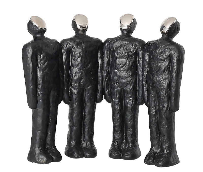 Three black, abstract, art-like figures made of a soft material, displayed in different orientations.