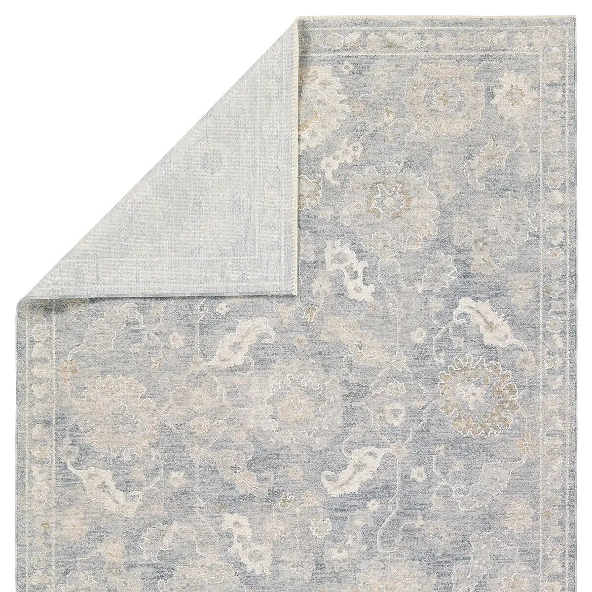 Gray and beige patterned rug on a white background