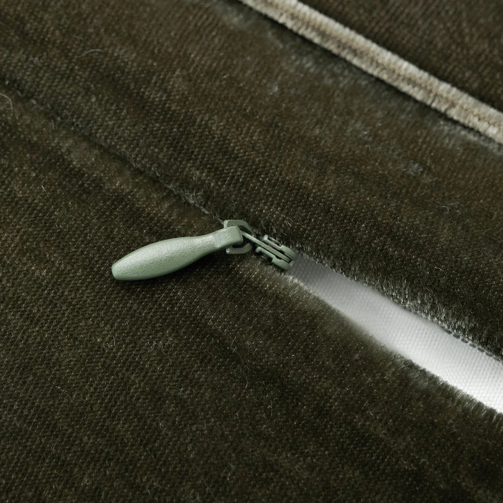 Close-up of a zipper on a dark fabric background