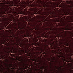 Close-up of a textured dark red fabric surface