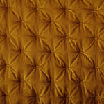 Close-up of a brown quilted fabric texture