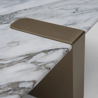 Bronze handle on a marble countertop