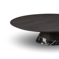Round dark wooden table with a marble base on a white background