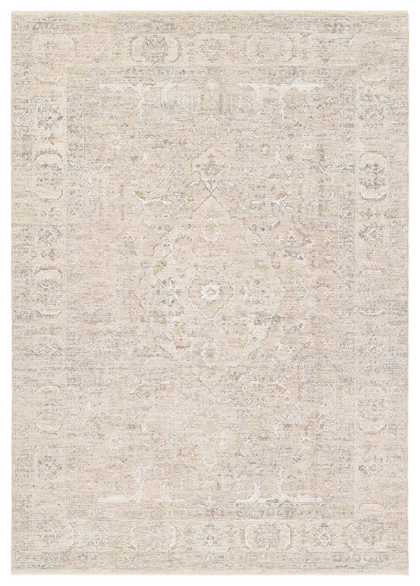 Beige area rug with subtle pattern on a plain background