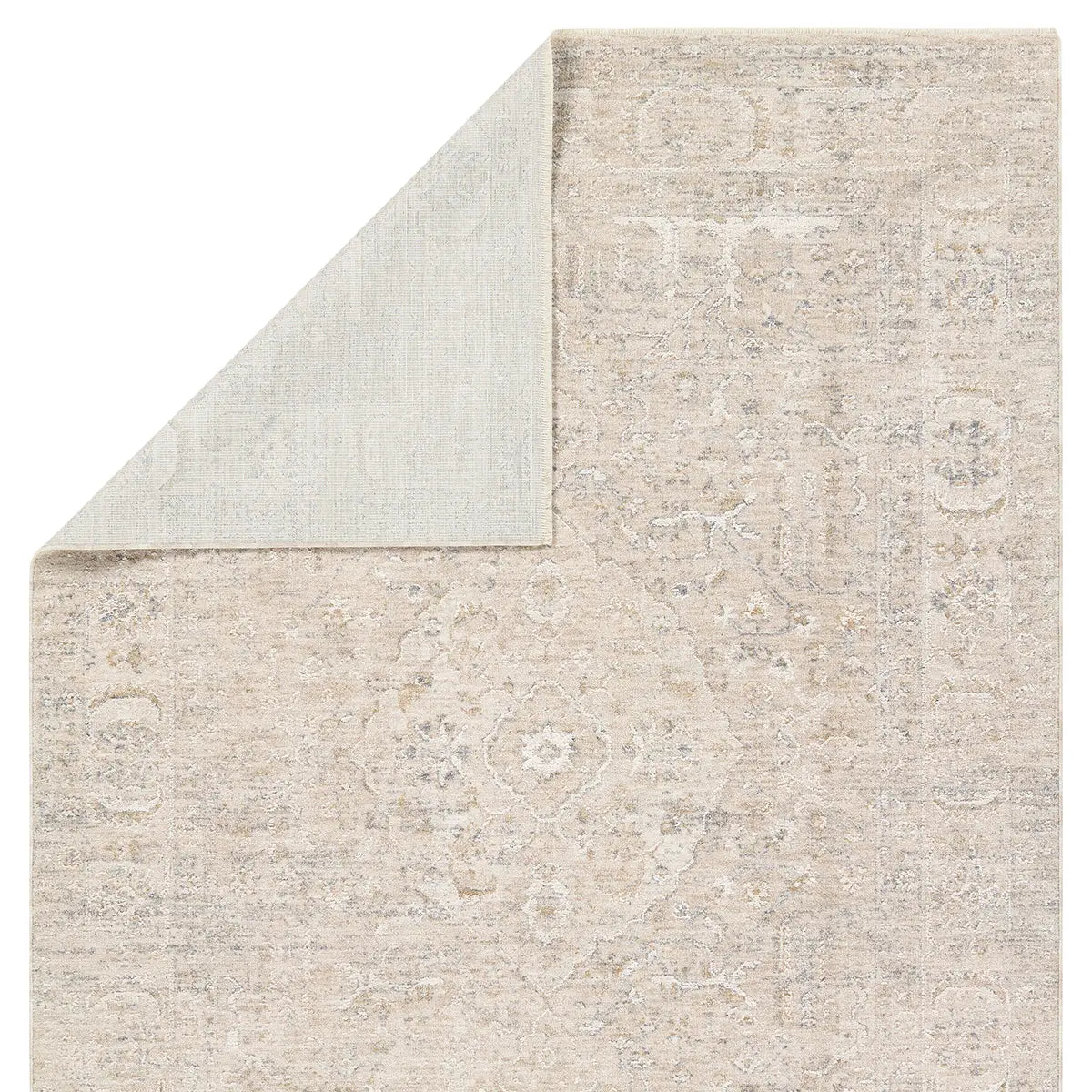 Close-up of a textured beige rug with subtle patterns on a white background