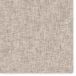 Textured beige carpet with a subtle pattern
